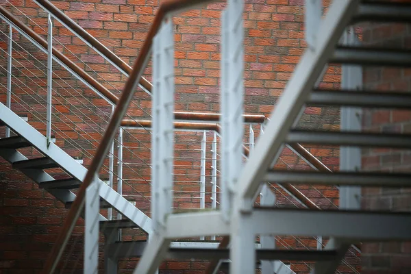 Metal stairs in a residential house loft type after the rain. Lithuania, Nid