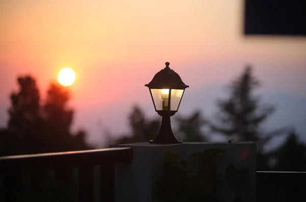 An ancient street lamp on the street at sunset. Greece, Kos Island.