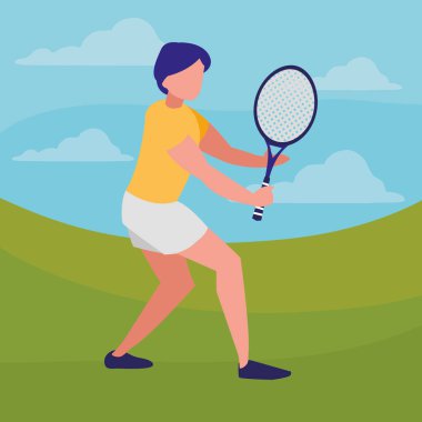 Genç adam tenis oynuyor.