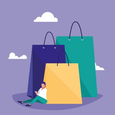 Genç adam akıllı telefon alışveriş çantası ile kullanma