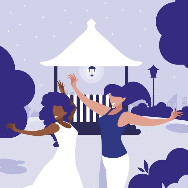 Молодые межрасовые девушки танцуют в парке — стоковый вектор