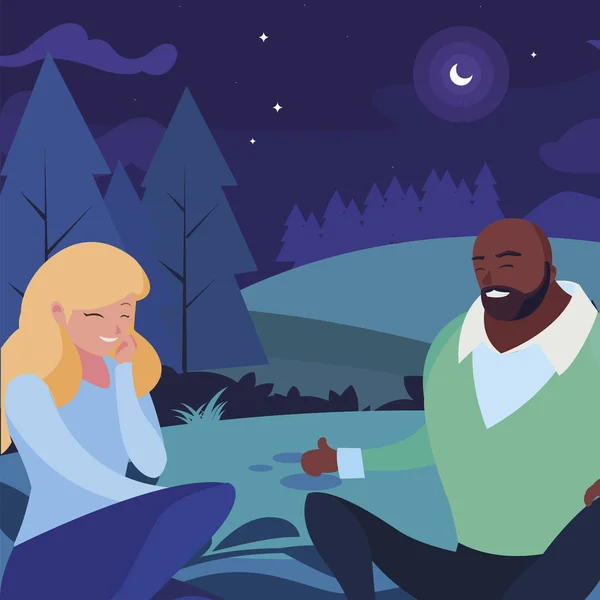 Interrazziale giovane coppia seduto nel campo di notte — Vettoriale Stock