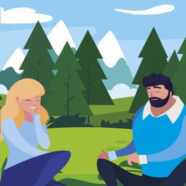 young couple seated in the field