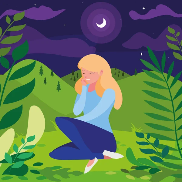 güzel kadın gece kampta oturan