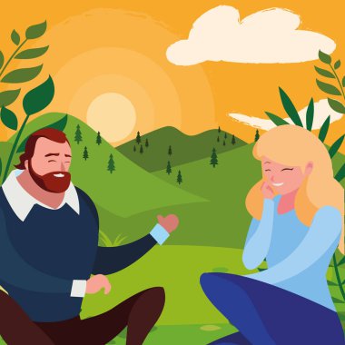 young couple seated in the field