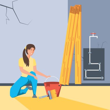 İnşaat halindeki evin içini boyayan kadın.