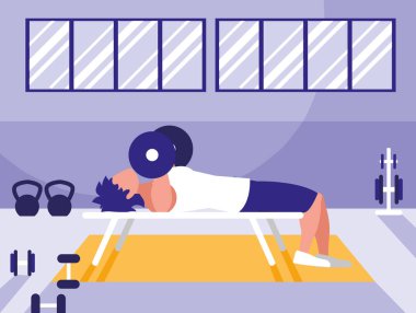Genç adam spor salonunda halter kaldırma