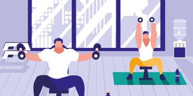 Spor salonunda dambılları kaldıran genç adamlar.