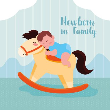 erkek bebek ve ahşap at ile yenidoğan kartı