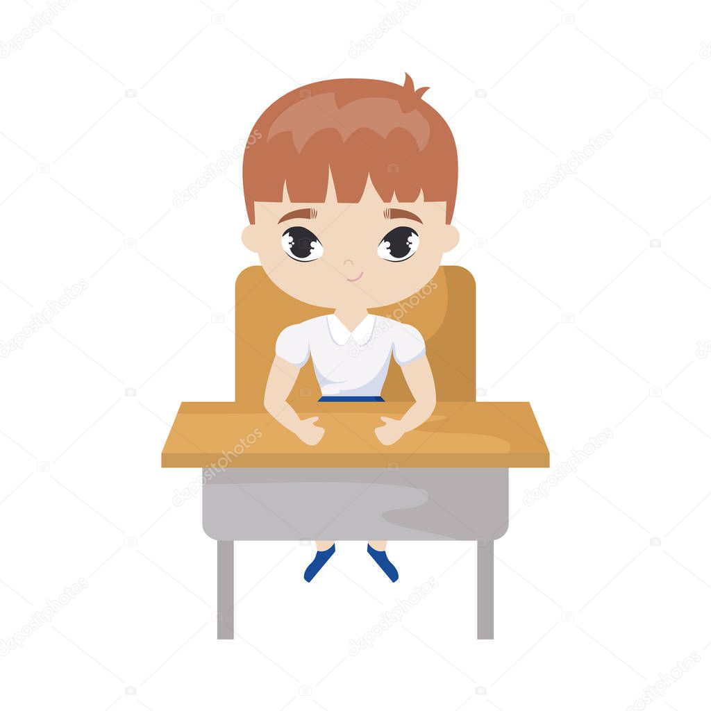 little student boy sitting in school desk