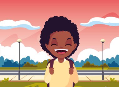 parkta çanta ile okul çocuğu