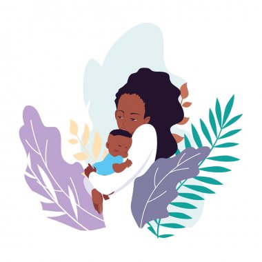 Anne kollarında bebeği taşıyan