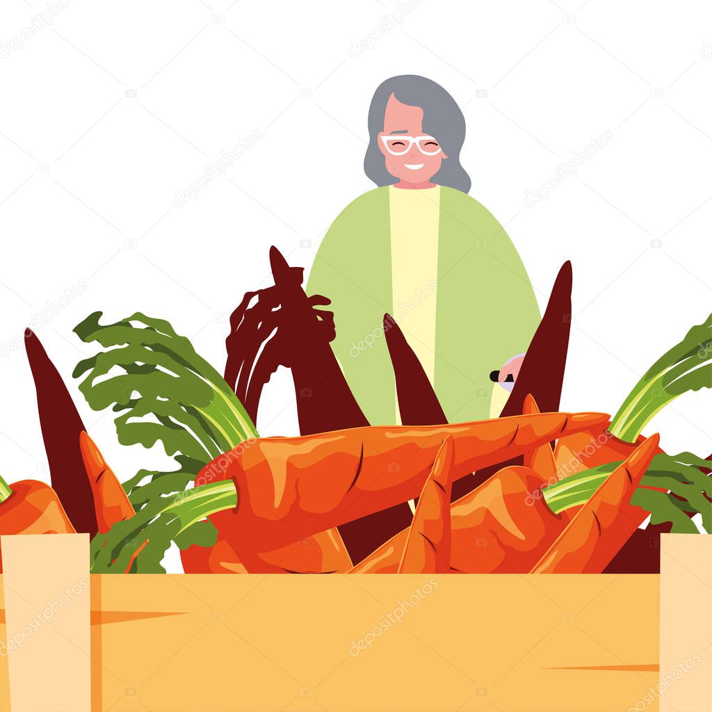 old woman shopping carrots in basket