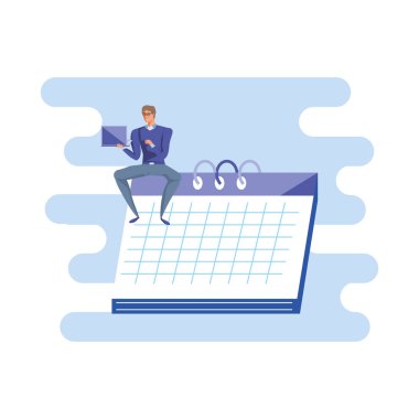 dizüstü bilgisayar ile takvimde oturan iş adamı