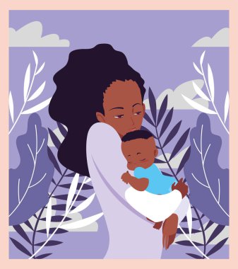 Anne kollarında bebeği taşıyan