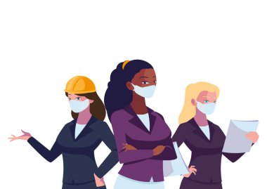 Yüz maskeleriyle çalışan kadın sanayi işçileri