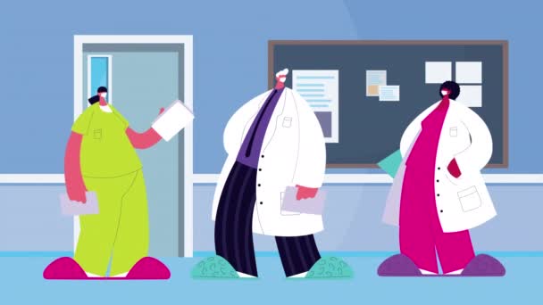 Προσωπικό ιατρών που φοράει ιατρική μάσκα για covid19 σε νοσοκομειακό χώρο — Αρχείο Βίντεο