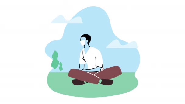 Young man wearing medical mask for covid19 prevention seated with lotus position — Stock Video