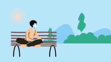 Park sandalyesinde oturan, kovid19 önleme için tıbbi maske takan genç adam.