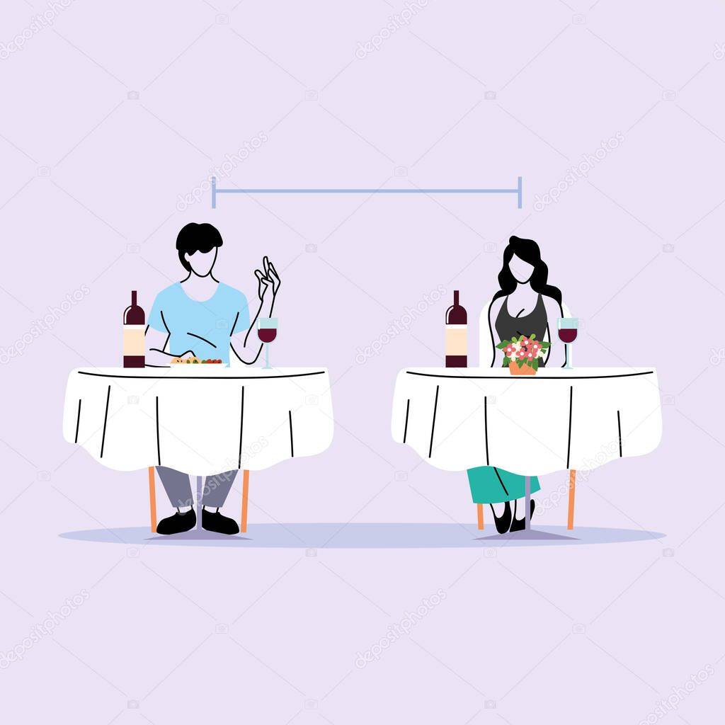 social distance in restaurant, a man and a woman sit a distance apart in separate tables with food