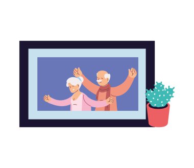 Evde gülümseyen dedelerin portresi.