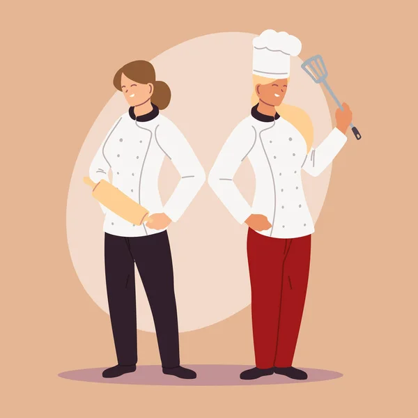 Jefes de cocina masculinos y femeninos en uniforme — Vector de stock