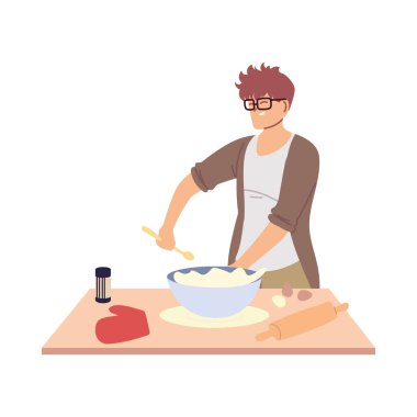 Genç adam pasta hazırlıyor.