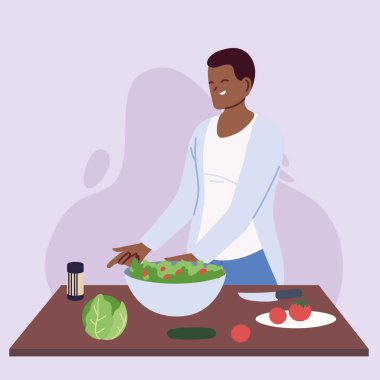 Genç aşçı sağlıklı yemek hazırlıyor.