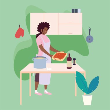 Genç bir kadın mutfakta lezzetli bir tarif pişiriyor.