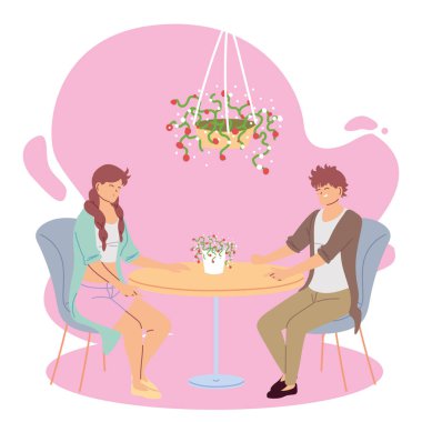 Birbirine aşık çiftler restoranda gülümsüyor ve konuşuyor.