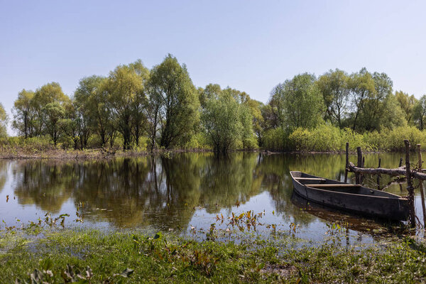 Wooden boat at village places in the floodplain forests of the Desna river, Ukraine