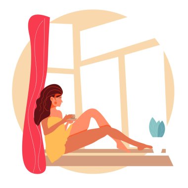 Evdeki kız pencereden dışarı bakar ve bir kahve içer.