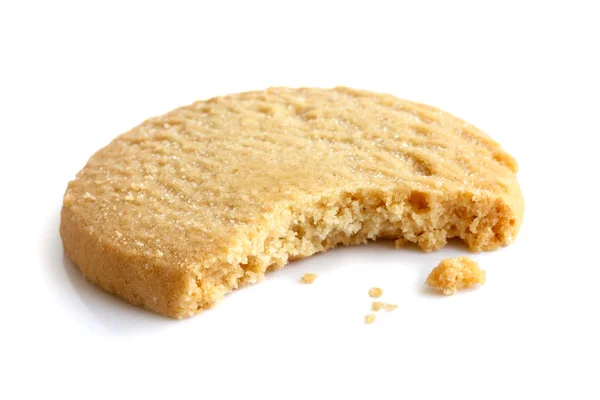 Single round shortbread biscuit with crumbs and bite missing. In — Stock Photo, Image