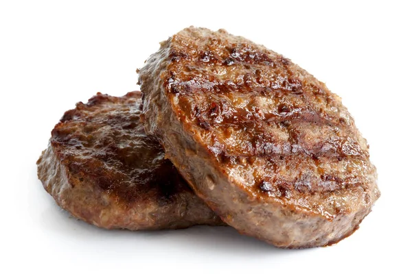 Twee gegrilde hamburger pasteitjes geïsoleerd op wit. — Stockfoto