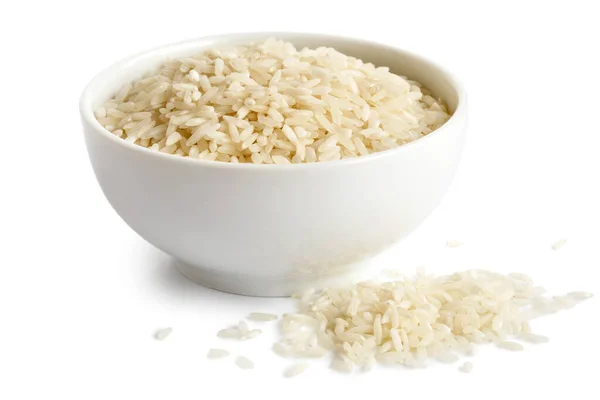 Cuenco de arroz blanco de grano largo aislado sobre blanco. Arroz derramado . — Foto de Stock