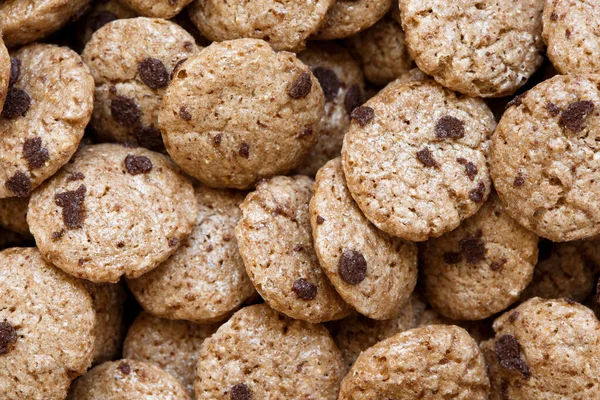 Background of chocolate chip cookies cereal from above. — Stock Photo, Image