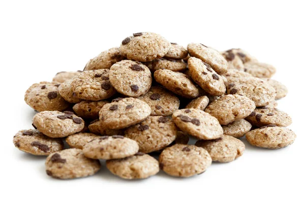 Heap of chocolate chip cookies cereal isolated on white. — Stock Photo, Image