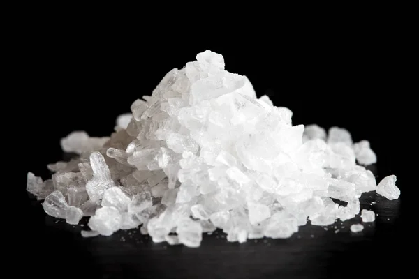 Heap of coarse salt isolated on black. Royalty Free Stock Images