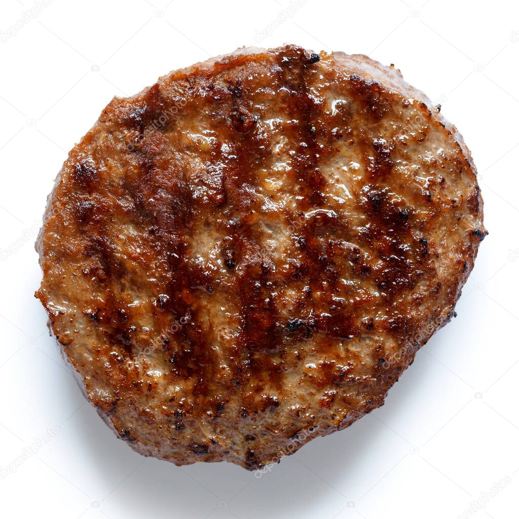 Single grilled hamburger patty isolated on white from above.
