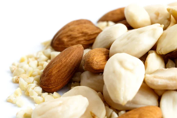 Detail of whole, chopped and blanched almonds mixed together. — Stock Photo, Image