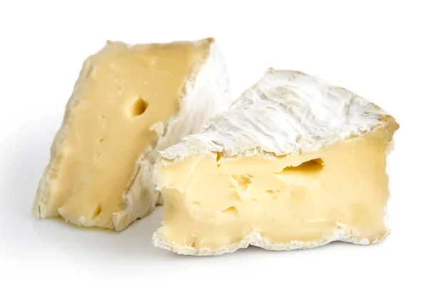 Two pieces of white mould cheese isolated on white. — Stock Photo, Image