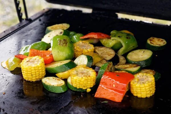 Mixed vegetables grilled on outdoor grill.