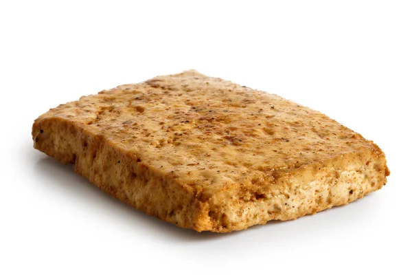 Single block of marinated tofu isolated on white. — Stock Photo, Image