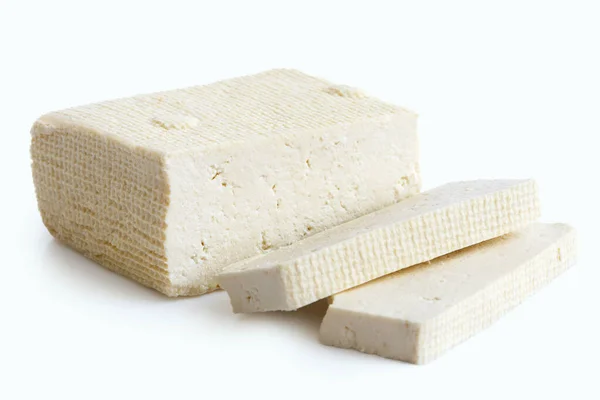 Block von weißem Tofu und zwei Scheiben isoliert auf weiß. — Stockfoto