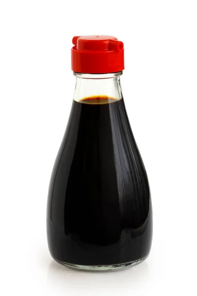 Glass bottle of soya sauce with red plastic lid isolated on whit — Stock Photo, Image