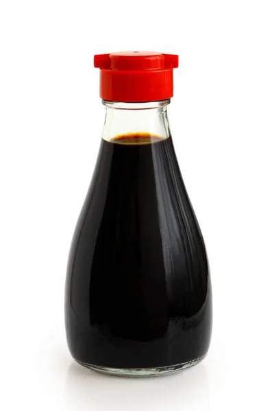 Glass bottle of soya sauce with red plastic lid isolated on whit — Stock Photo, Image