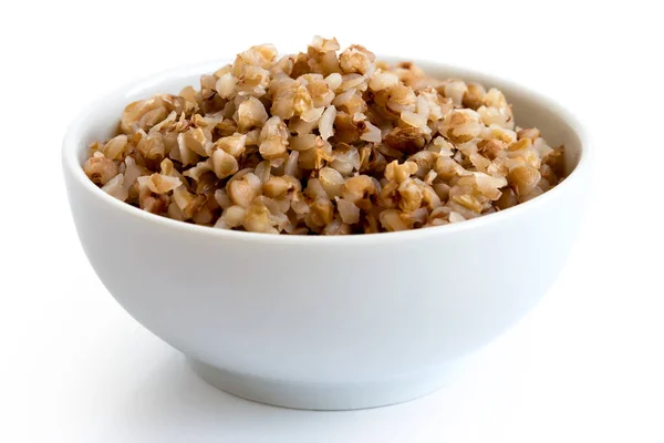 Cooked buckwheat in white ceramic bowl isolated on white. — Stock Photo, Image