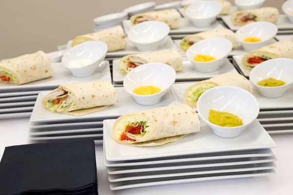 Cheese and chicken tortilla wraps with dip. Modern catering.