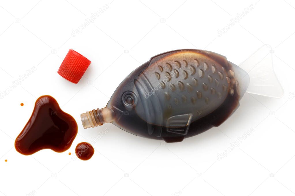 Open fish shaped take away soya sauce isolated on white from abo
