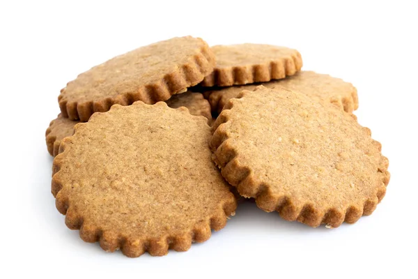 A pile of round gingerbread biscuits isolated on white. Serrated — Stock Photo, Image